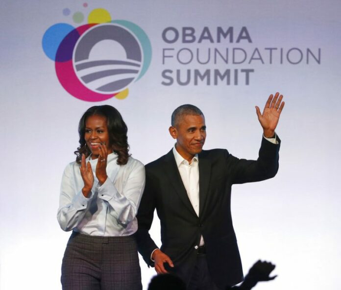 Barack Obama, Michelle Obama Former President Barack Obama and former first lady Michelle Obama arriving for the first session of the Obama Foundation Summit in Chicago. Photo: Charles Rex Arbogast / Associated Press