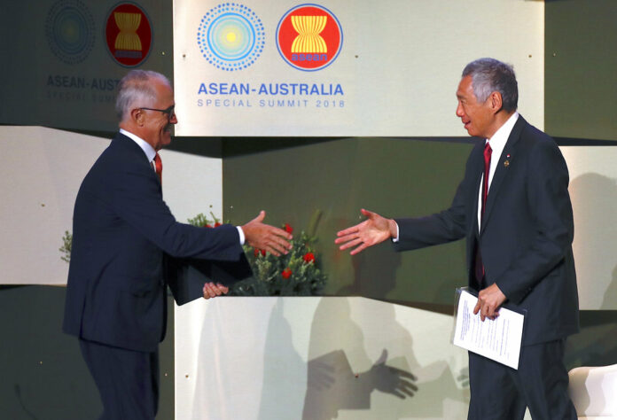 Australian Prime Minister Malcolm Turnbull, left, shakes hands with the Prime Minister of Singapore Lee Hsien Loong at the start of the Small-and-Medium sized Enterprises conference held in March during the one-off summit of 10-member Association of Southeast Asian Nations (ASEAN) on Friday in Sydney, Australia. Photo: Dave Gray / Associated Press