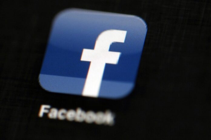 Facebook logo is displayed on an iPad in Philadelphia. Photo: Matt Rourke / Associated Press