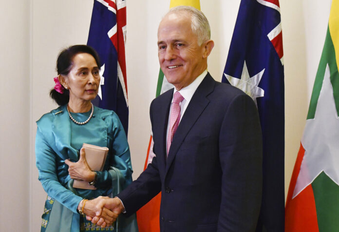 Myanmar's leader Aung San Suu Kyi, left, is welcomed to Parliament House by Australian Prime Minister Malcolm Turnbull during her Monday state visit in Canberra. Photo: Mick Tsikas / Associated Press