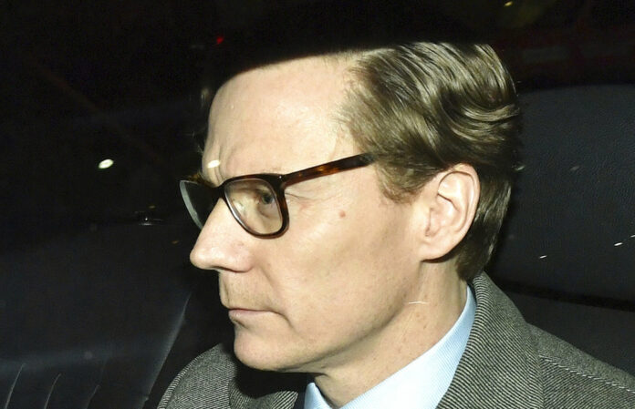 Chief Executive of Cambridge Analytica (CA) Alexander Nix, leaves the offices Tuesday in central London. Photo: Dominic Lipinski / Associated Press
