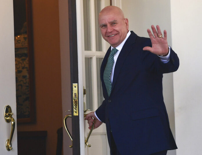 National security adviser H.R. McMaster waves March 16 as he walks into the West Wing of the White House in Washington. Photo: Susan Walsh / Associated Press