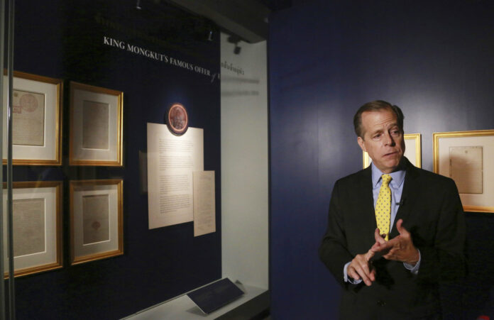 U.S. Ambassador to Thailand Glynn Davies talks to media Thursday in front of hand-written letters from U.S. President Abraham Lincoln and King Mongkut on display at the 