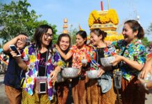 Relive the Ole Days At King Rama X Songkran Fest Revellers dressed in traditional Songkran outfits celebrate the Thai New Year on April 13, 2017, in Phetchabun province.
