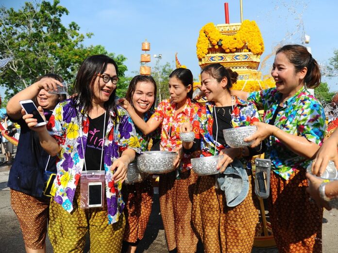 Revellers dressed in traditional Songkran outfits celebrate the Thai New Year on April 13, 2017, in Phetchabun province.