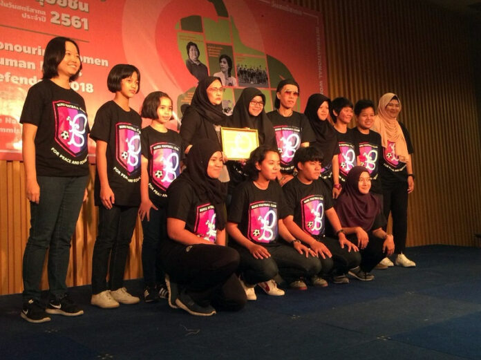 Members of the Buku FC on Wednesday at an awards ceremony at the Bangkok Art and Culture Centre.
