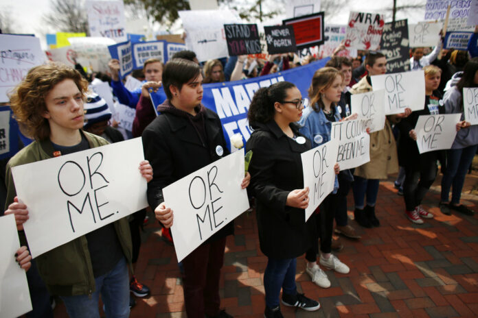 People participate in a 'March For Our Lives' event on Saturday in Norfolk, Virgina. Students and activists across the country planned events Saturday in conjunction with a Washington march spearheaded by teens from Marjory Stoneman Douglas High School in Parkland, Florida, where over a dozen people were killed in February. Photo: Stephen M. Katz / The Virginian-Pilot