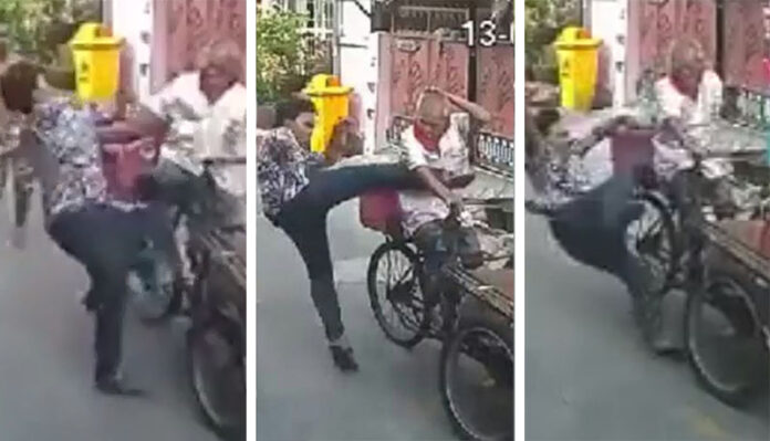 Narathorn Soattiyung kicks saleng driver Juroon Meepan on Tuesday in a still image taken from a security camera in Bangkok’s Din Daeng district.