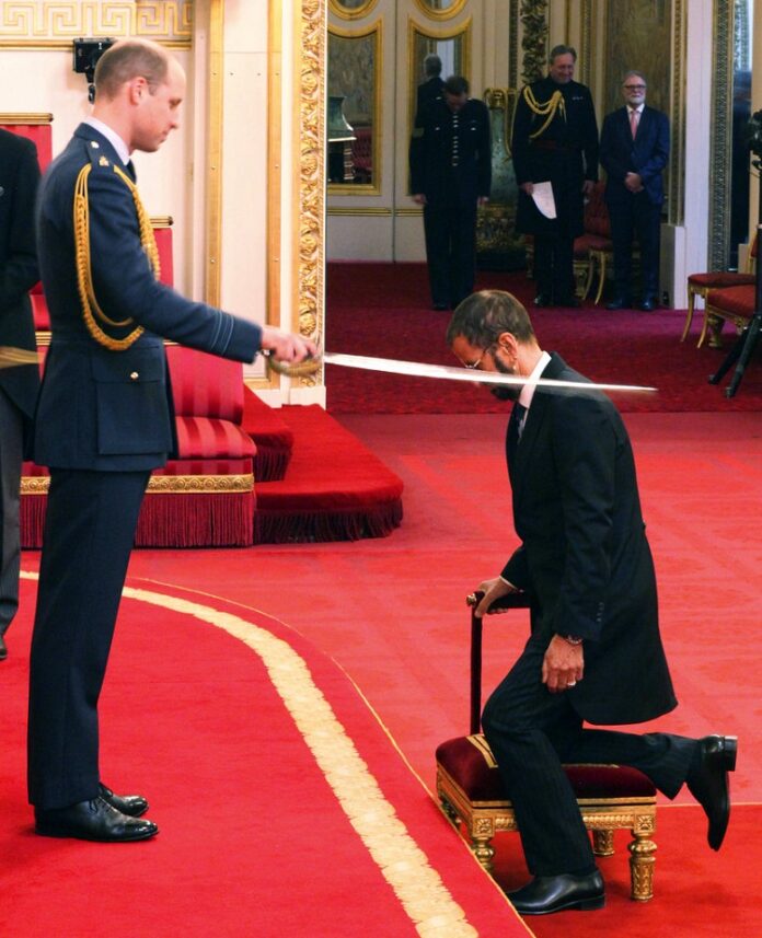 Former Beatle Ringo Starr, is made a knight by Britain's Prince William at Buckingham Palace during an Investiture ceremony in London on Tuesday. Photo: Yui Mok / Associeted Press