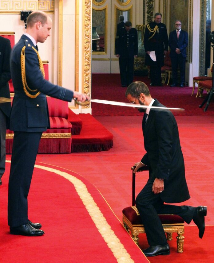 Britain Investiture Former Beatle Ringo Starr, is made a knight by Britain's Prince William at Buckingham Palace during an Investiture ceremony in London on Tuesday. Photo: Yui Mok / Associeted Press