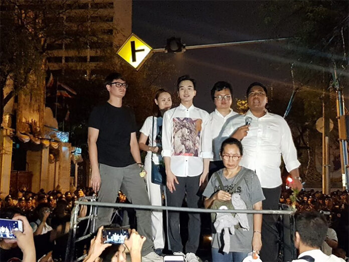 Standing on truck from left: Rangsiman Rome, Nuttaa Mahattana, Karn Pongprapaphan, Arnon Nampha, an unidentified woman and Sirawith Seritiwat during a March 24 rally.