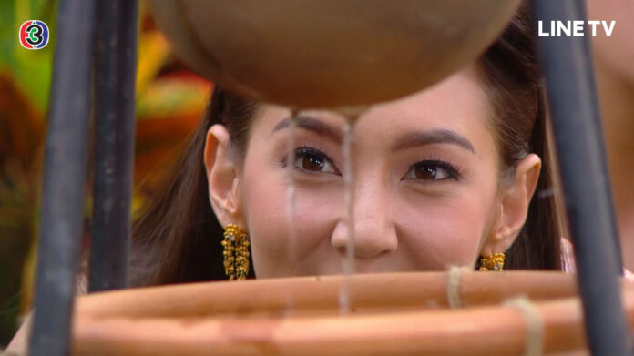 Karakade (Bella Campen) tests out her water filter in episode 7 of Bupphesaniwat.