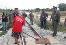 Man Tries to Derail Trains to Avenge Fish Pond Padungsak Kunnasak on Thursday participates in a police ‘re-enactment’ of his alleged attempt to derail a train in Prachuap Khiri Khan. Photo: Matichon