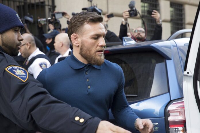 UFC star Conor McGregor heads to a vehicle to leave Brooklyn Criminal Court. Photo: Mary Altaffer / Associated Press