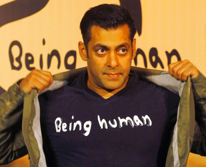 Hollywood star Salman Khan poses wearing a Being Human T-shirt during the launch of Being Human's first flagship store in Mumbai, India. Photo: Rafiq Maqbool / Associated Press