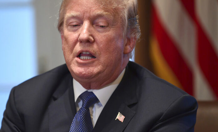 President Donald Trump speaks in the Cabinet Room of the White House in Washington on Monday. Photo: Susan Walsh / Associated Press