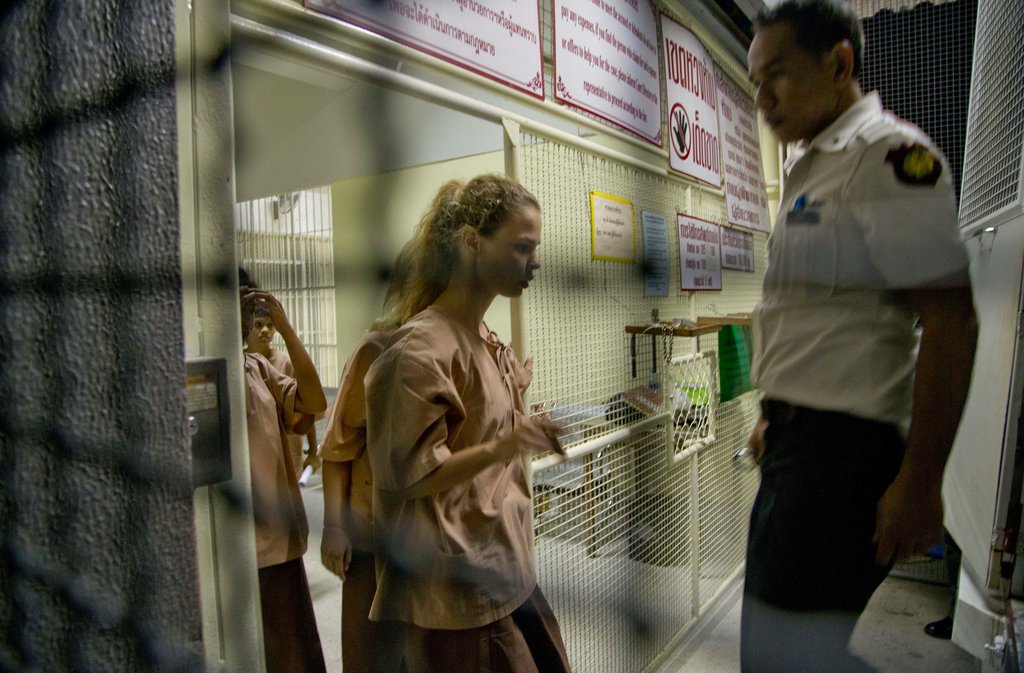 Anastasia Vashukevich, center, walks into a prison transport vehicle outside a courthouse in Pattaya, south of Bangkok, Thailand, on Tuesday. Photo: Gemunu Amarasinghe / Associated Press