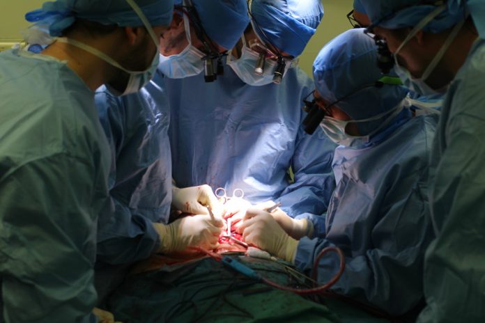 Surgeons perform a face transplant on Jerome Hamon. Photo: HEGP / Associated Press