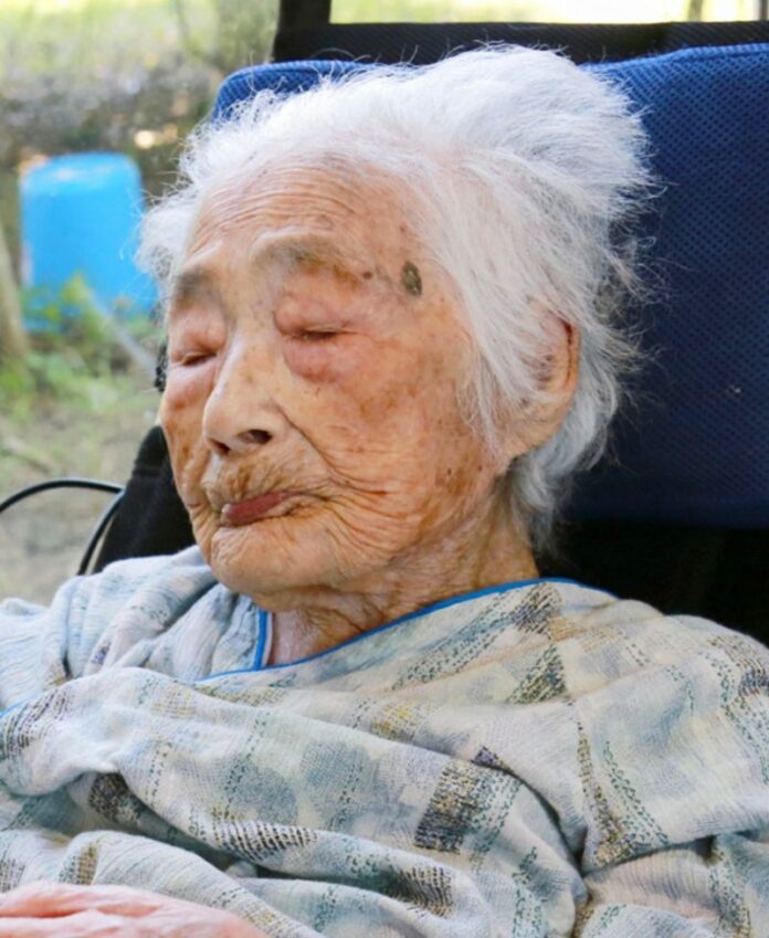 Nabi Tajima, the world's oldest person, in a hospital Saturday evening, in the town of Kikai in southern Japan. Kyodo News / Associated Press