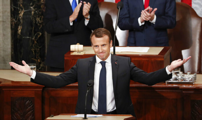 French President Emmanuel Macron gestures as he is introduced before speaking to a joint meeting of Congress, Wednesday on Capitol Hill in Washington. Photo: Pablo Martinez Monsivais / Associated Press