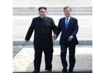 SKorea’s Moon Wants ‘Irrevocable’ Progress on Nuke Diplomacy North Korean leader Kim Jong Un, left, and South Korean President Moon Jae-in cross the military demarcation line to the South side in April at the border village of Panmunjom in the Demilitarized Zone. Photo: Associated Press