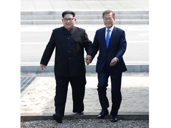 North Korean leader Kim Jong Un, left, and South Korean President Moon Jae-in cross the military demarcation line to the South side in April at the border village of Panmunjom in the Demilitarized Zone. Photo: Associated Press North Korean leader Kim Jong Un, left, and South Korean President Moon Jae-in cross the military demarcation line to the South side in April at the border village of Panmunjom in the Demilitarized Zone. Photo: Associated Press