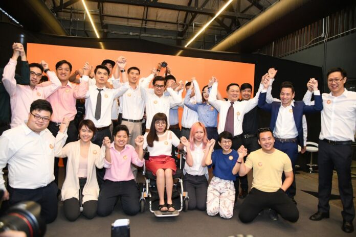 Thanathorn Juangroongruangkit, back row fifth from left, and the founding members of the Future Forward Party on March 15 at Warehouse Charoenkrung .