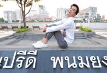 Young Rebel Plants Rainbow Flag on Pro-Democracy Stage