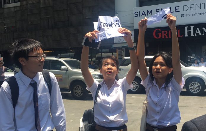 Students protest junta chairman Prayuth Chan-ocha on Monday at Siam Square.