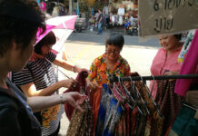 Vendors Cash In Before Traditional Garb Fad Fades Banglamphu vendor Orasa Sae Jong sells traditional attire Thursday in Bangkok.
