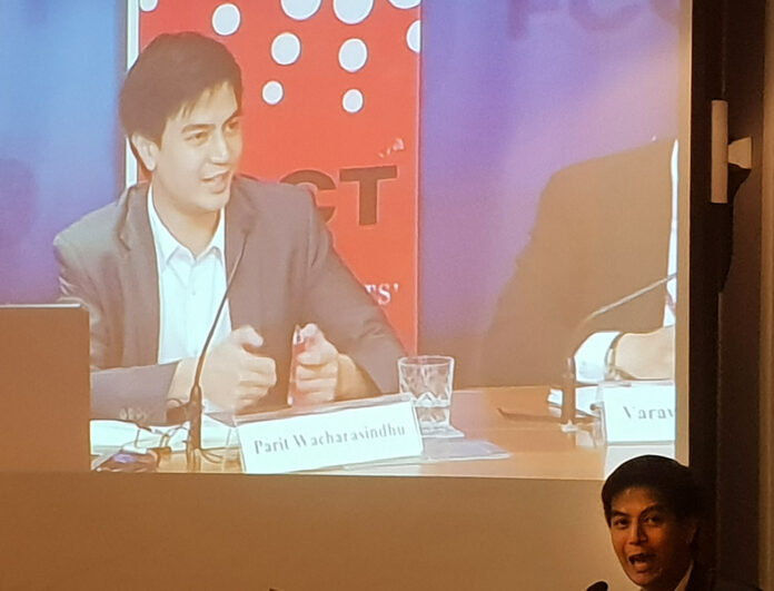 Parit Wacharasindhu of the Democrat Party speaks in Bangkok on Wednesday evening at the Foreign Correspondents' Club of Thailand.