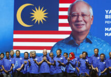 Once Seen as Reformer, Malaysia Leader Faces Legitimacy Test Malaysia's prime minister and president of the ruling party coalition "National Front," Najib Razak, center, prays at an April 7 launch event for upcoming general elections in Kuala Lumpur, Malaysia. Photo: Vincent Thian / Associated Press