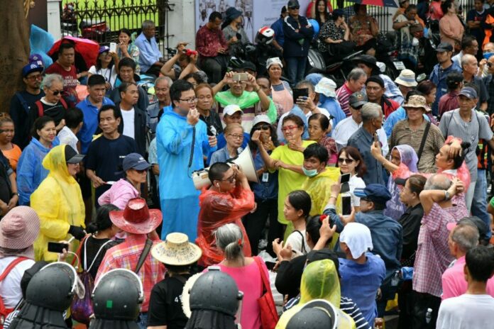 Protest leader Arnon Nampha makes a speech to demonstrators on May 22