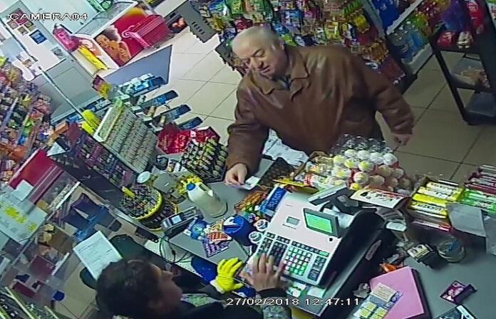 FILE - In this Feb. 27, 2018 file grab taken from CCTV video provided by ITN, former spy Sergei Skripal shops at a store in Salisbury, England.