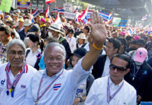 Suthep Aides Register Party, Deny It’s For Him Suthep Thaugsuban waves to supporters on Jan. 17, 2014, while leading a street protest in Bangkok.