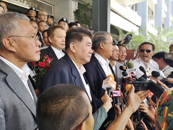 Pheu Thai politicians report to police Monday in Bangkok. Pheu Thai politicians report to police Monday in Bangkok.