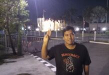 Activist Marches Solo to Govt House After Bail Sirawith “Ja New” Serithiwat Thursday stands in front of the government house. Photo: Sirawith Seritiwat / Facebook