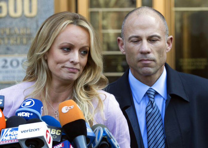 FILE - In this April 16, 2018, file photo, adult film actress Stormy Daniels, left, stands with her lawyer Michael Avenatti as she speaks outside federal court in New York. Photo: Mary Altaffer / Associated Press