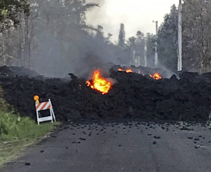 The image on Friday shows lava flowing over Mohala Street in the Leilani Estates area near Pahoa on the Big Island of Hawaii. Photo: Hawaii Electric Light / Associated Press The image on Friday shows lava flowing over Mohala Street in the Leilani Estates area near Pahoa on the Big Island of Hawaii. Photo: Hawaii Electric Light / Associated Press