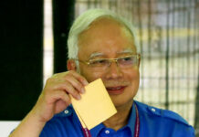 Former Malaysian PM Najib Questioned by Anti-Graft Agency Malaysian Prime Minister Najib Razak shows his ballot as he votes May 9 at his hometown in Pekan, Pahang state, Malaysia. Photo: Aaron Favila / Associated Press