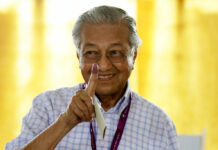 Malaysia’s Mahathir Aims to Scrap China Deals Former Malaysian strongman Mahathir Mohamad shows his finger that is marked in ink after voting in May for the general election in Alor Setar, state capital of Kedah, northern Malaysia. Photo: Andy Wong / Associated Press