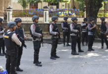 5 Officers, 1 Inmate Dead in Indonesia Detention Center Riot Indonesian Police officers man a roadblock outside the headquarters of elite police force Mobile Brigade, following a prison riot inside the compound Wednesday in Depok, West Java, Indonesia. Photo: Dita Alangkara / Associated Press
