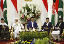 Muslim Scholars: Suicide Attacks Violate Islamic Principles From left to right, Head of Indonesian Ulema Council Ma'ruf Amin, Head of Ulema Council of Afghanistan Qiamuddin Kashaf, Indonesian President Joko Widodo, his deputy Jusuf Kalla, and Chairman of Pakistan's Council of Islamic Ideology Qibla Ayaz attend the opening ceremony of the trilateral religious meeting among Islamic scholars from Afghanistan, Pakistan, and Indonesia at the presidential palace Friday in Bogor, West Java, Indonesia. Photo: Dita Alangkara / Associated Press