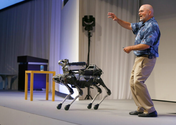 Boston Dynamics Chief Executive Marc Raibert speaks about his four-legged robot SpotMini during a SoftBank World presentation in 2017 at a hotel in Tokyo. Photo: Shizuo Kambayashi / Associated Press