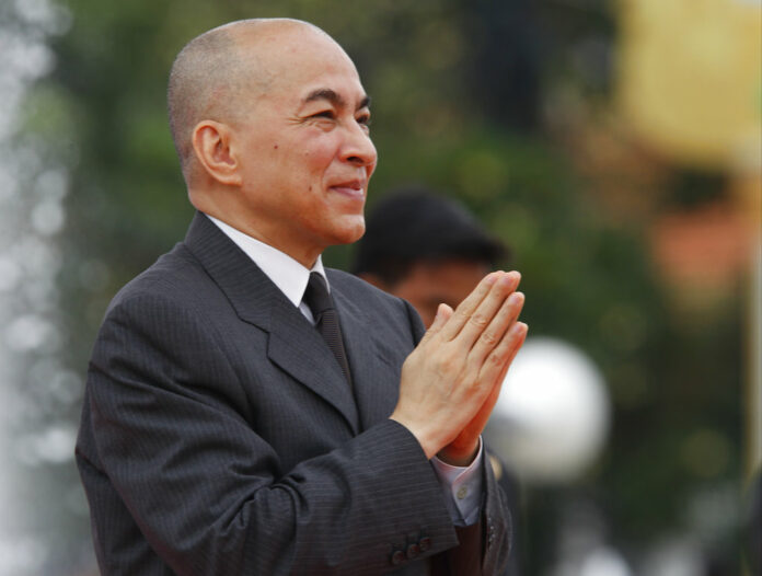 Cambodia's King Norodom Sihamoni greets his government officers in November during the Independence Day celebrations, in Phnom Penh, Cambodia. Photo: Heng Sinith / Associated Press