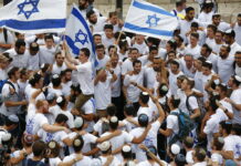 Israel, Myanmar Agree to ‘Verify’ Taught History of Other Israeli youths wave national flags in May outside the Old City's Damascus Gate, in Jerusalem. Photo: Ariel Schalit / Associated Press