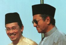 Voting Opens in Malaysia By-Election for PM-in-Waiting Anwar Anwar Ibrahim, left, stands next to Malaysia Prima Minister Mahathir Mohamad during the 1998 UMNO Annual Meeting in Kuala Lumpur. Photo: Vincent Thian / Associated Press