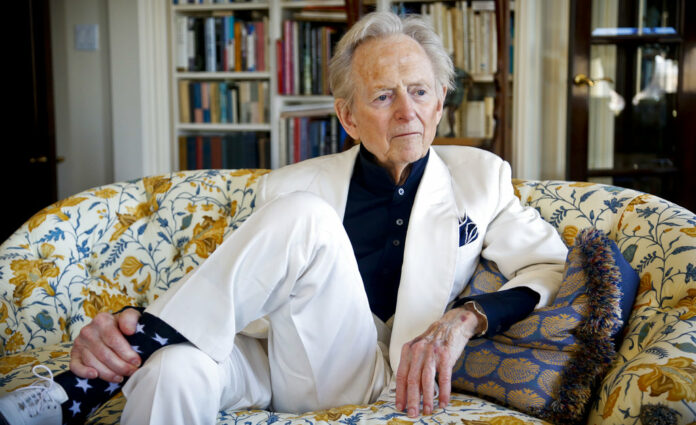 American author and journalist Tom Wolfe, Jr. appears in his living room during an interview about his latest book, 