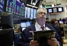 Stocks at Records; Dow Beats All-Time High From January Trader Frank O'Connell works in May on the floor of the New York Stock Exchange. Photo: Richard Drew / Associated Press