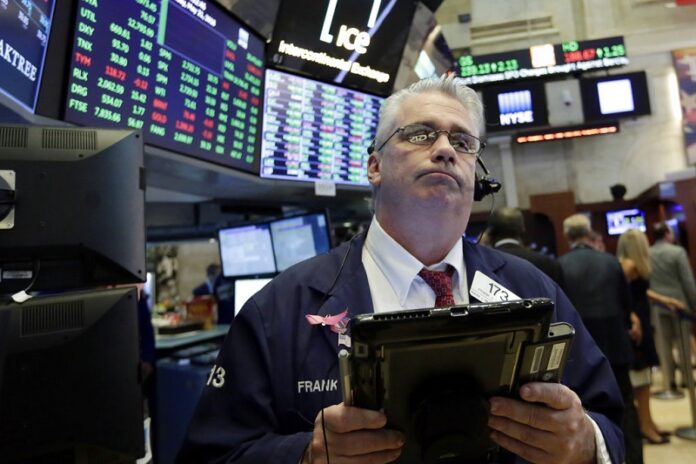Trader Frank O'Connell works in May on the floor of the New York Stock Exchange. Photo: Richard Drew / Associated Press